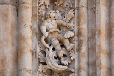 Astronaut carved in stone in the Salamanca Cathedral Facade clipart