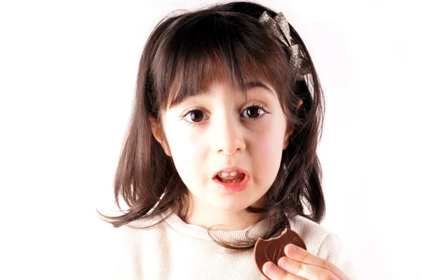 Girl eats chocolate — Stock Photo, Image