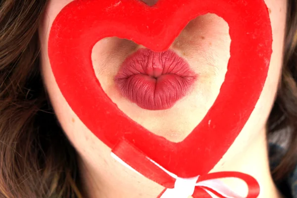 Girl with red heart — Stock Photo, Image