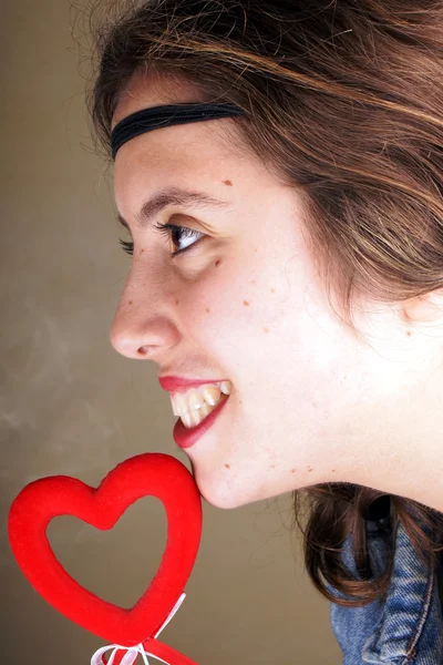 Girl with red heart — Stock Photo, Image