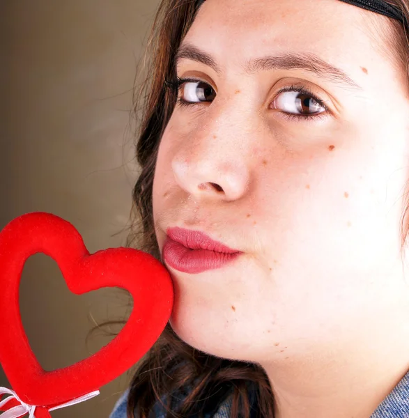 Girl with red heart — Stock Photo, Image