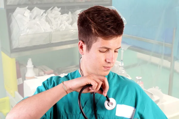 Studio shot of a young man with medical clothes — Stock Photo, Image