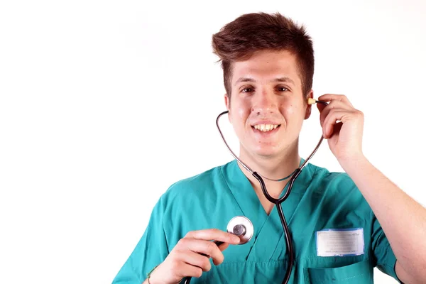 Studio shot van een jonge man met medische kleding — Stockfoto