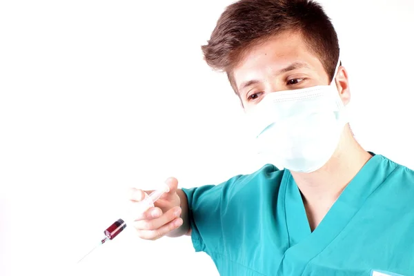 Studio shot of a young man with medical clothes — Stock Photo, Image