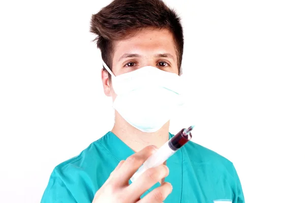 Studio shot of a young man with medical clothes — Stock Photo, Image