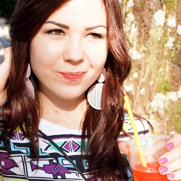 Young lady eating slush in the park — Stock Photo, Image