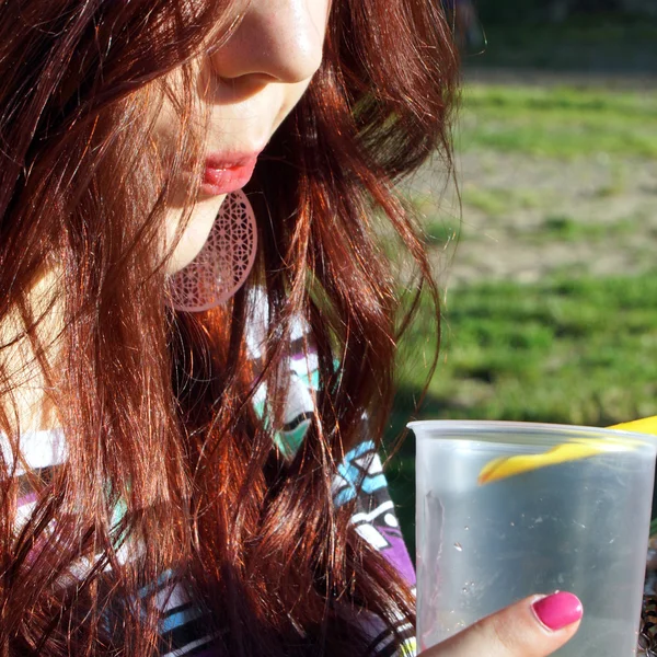 Young lady eating slush in the park — Stock Photo, Image