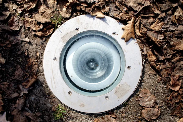Detail of a lamp in the ground — Stock Photo, Image