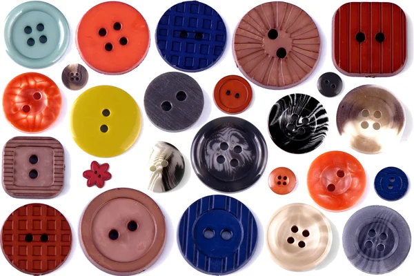Gruppo di diversi pulsanti colorati su sfondo bianco — Foto Stock