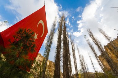 Ihlara Valley with Turkey flag, Rock Site of Cappadicia, Turkey clipart