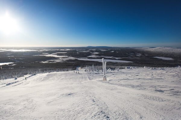 Beautiful cold mountain view of ski resort, sunny winter day with slope, piste and ski lift