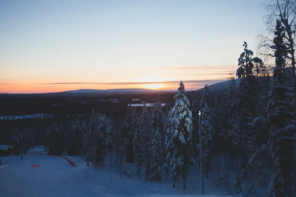 Beautiful cold mountain view of ski resort, sunny winter day with slope, piste and ski lift