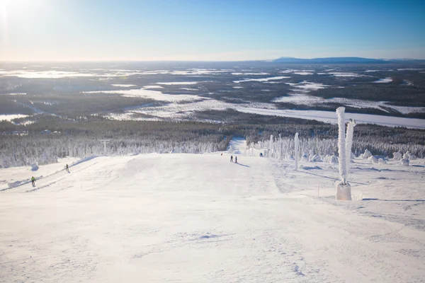 Beautiful cold mountain view of ski resort, sunny winter day with slope, piste and ski lift