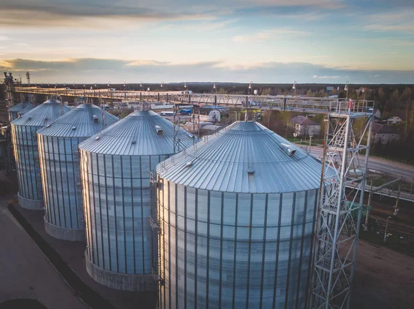 Aerial top view of Grain Elevator Silos, Granary of a feed mill built of modern metal structures, drone shot