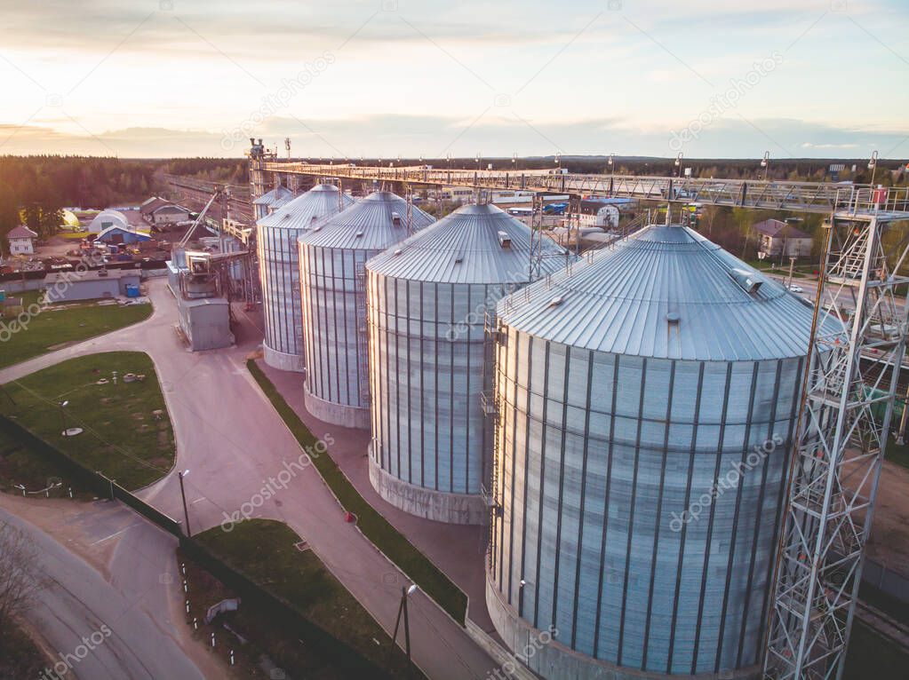 Aerial top view of Grain Elevator Silos, Granary of a feed mill built of modern metal structures, drone shot