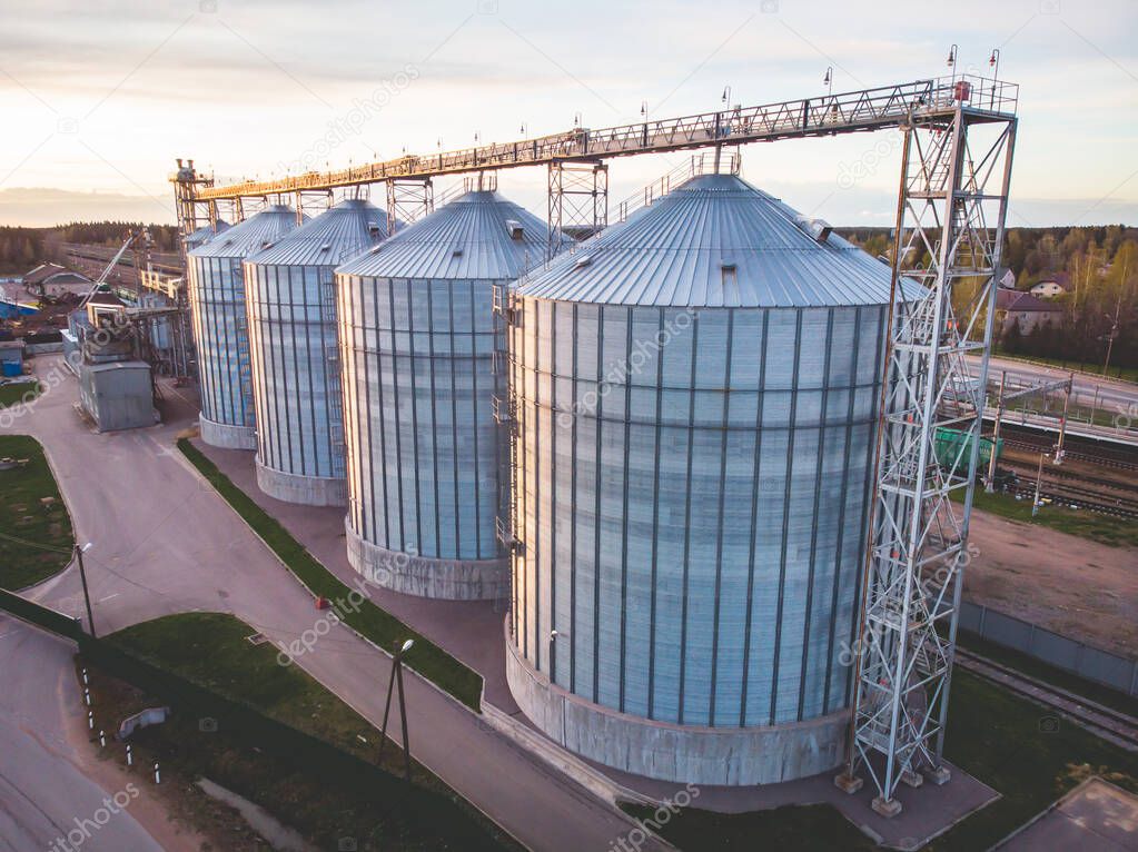 Aerial top view of Grain Elevator Silos, Granary of a feed mill built of modern metal structures, drone shot