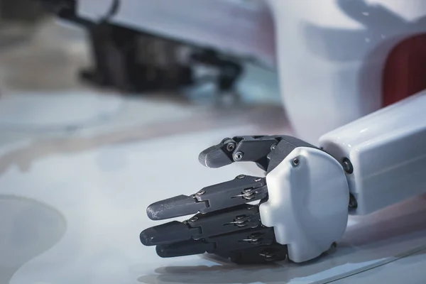 Hydraulic mechanical cyborg robot arm in hand shake gesture, robotized manipulator on  manufacture line