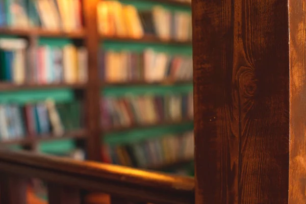 Old university college library interior with a bookshelves, books and bookcase, classic style school interior archive with wooden ladder staircase