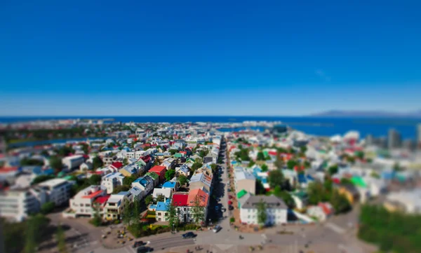 Beautiful super wide-angle aerial view of Reykjavik, Iceland with harbor and skyline mountains and scenery beyond the city, seen from the observation tower of Hallgrimskirkja Cathedral. — Stock Photo, Image