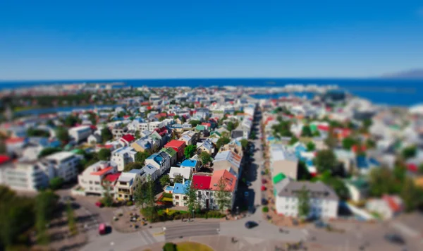 Beautiful super wide-angle aerial view of Reykjavik, Iceland with harbor and skyline mountains and scenery beyond the city, seen from the observation tower of Hallgrimskirkja Cathedral. — Stock Photo, Image