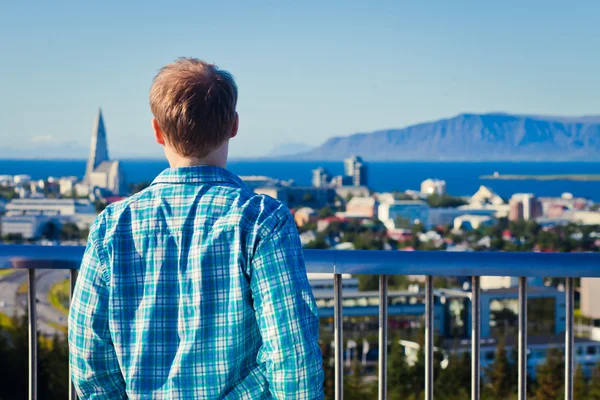 Beautiful super wide-angle aerial view of Reykjavik, Iceland with harbor and skyline mountains and scenery beyond the city, seen from the observation tower of Hallgrimskirkja Cathedral. — Stock Photo, Image