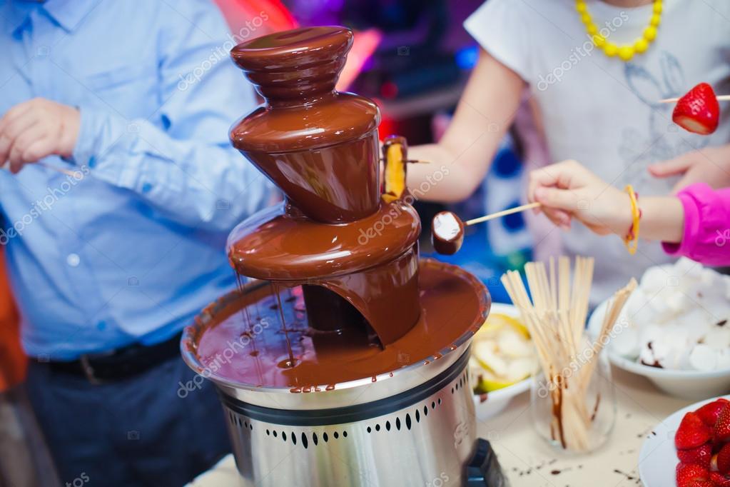 Vibrant Picture of Chocolate Fountain Fontain on childen kids birthday