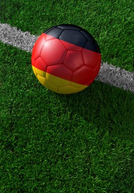 Futbol topu ve Almanya, yeşil çim ulusal bayrak