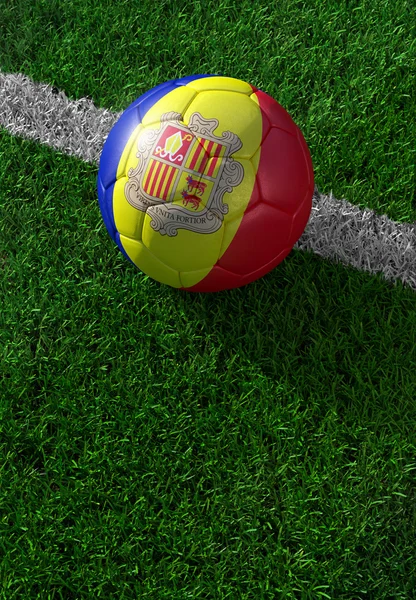 Soccer ball and national flag of Andora,  green grass — Stock Photo, Image