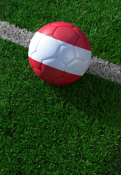 Soccer ball and national flag of Austria,  green grass — Stock Photo, Image