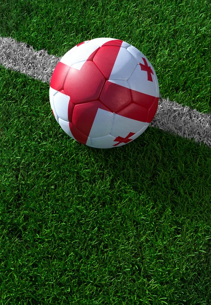 Soccer ball and national flag of Georgia,  green grass — Stock Photo, Image