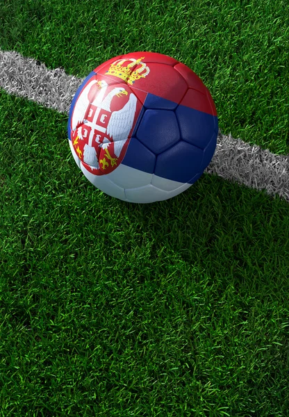 Soccer ball and national flag of Serbia,  green grass — Stock Photo, Image