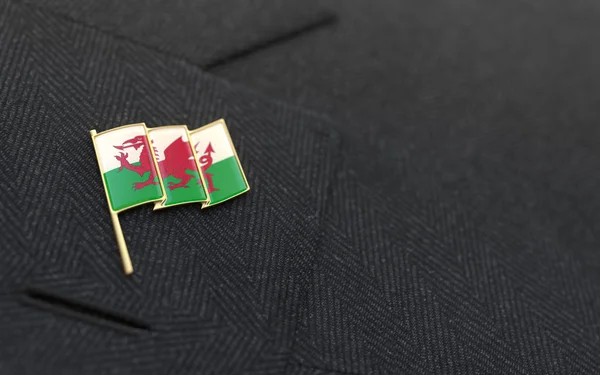 Wales flag lapel pin on the collar of a business suit — Stock Photo, Image