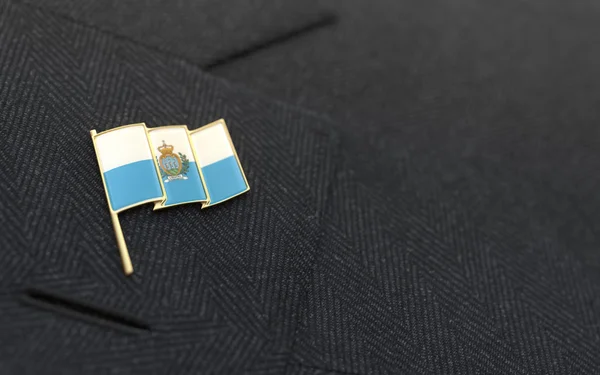 San Marino flag lapel pin on the collar of a business suit — Stock Photo, Image
