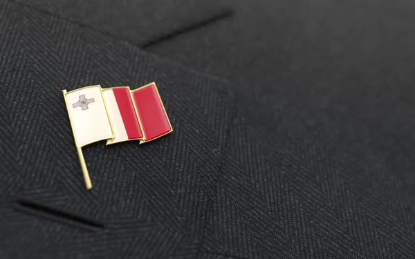 Malta flag lapel pin on the collar of a business suit — Stock Photo, Image