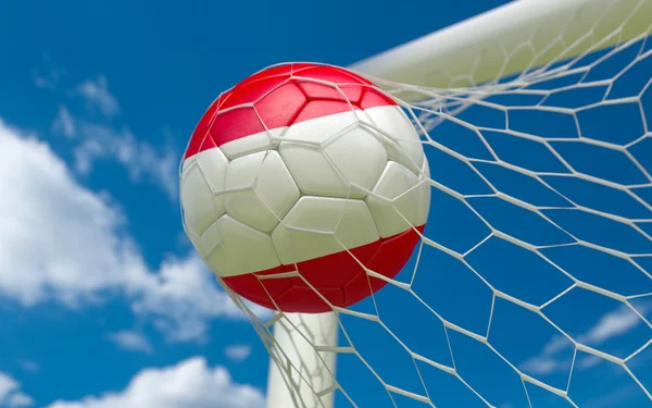 Austria ondeando bandera y pelota de fútbol en la red de gol —  Fotos de Stock