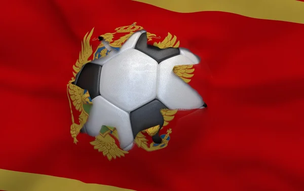 O buraco na bandeira de Montenegro e bola de futebol — Fotografia de Stock