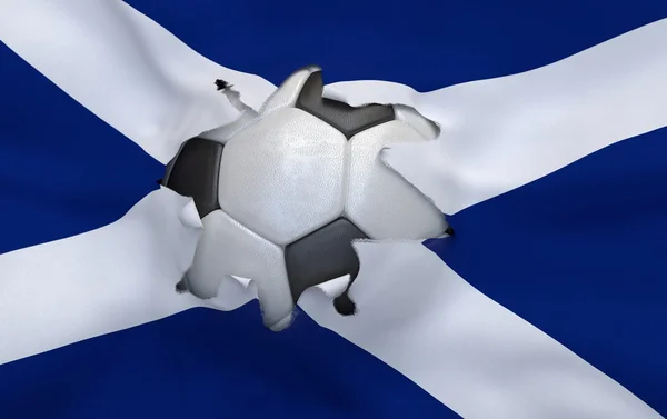 Le trou dans le drapeau de l'Écosse et le ballon de football — Photo