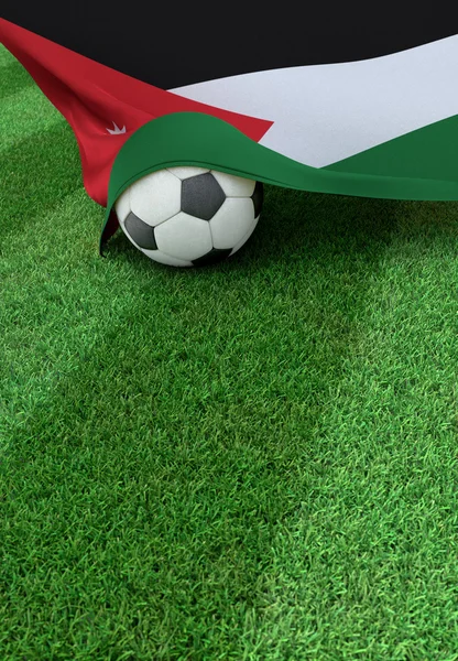 Soccer ball and national flag of Jordan,  green grass — Stock Photo, Image