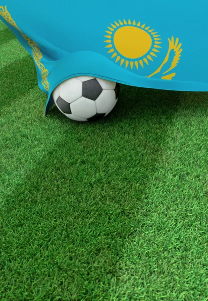 Soccer ball and national flag of Kazakhstan,  green grass — Stock Photo, Image