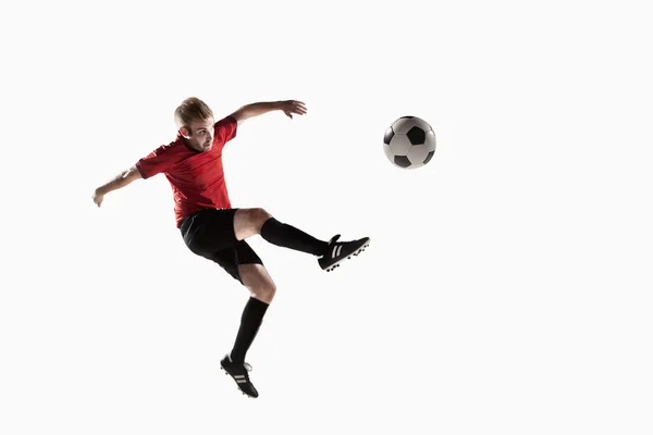 Athlete kicking soccer ball — Stock Photo, Image