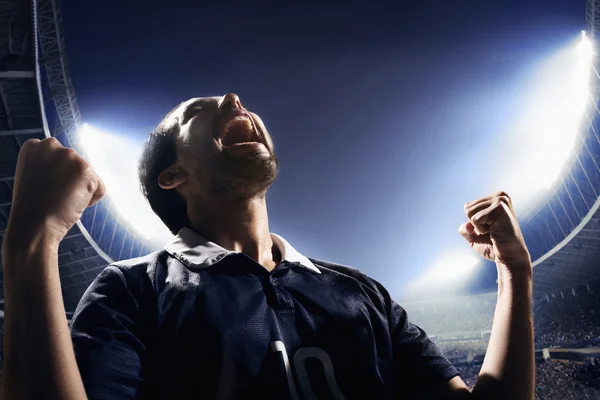 Athlete cheering on the stadium — Stock Photo, Image