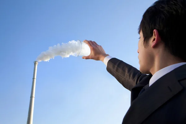 Businessman Collecting Smoke in Beaker — Stock Photo, Image