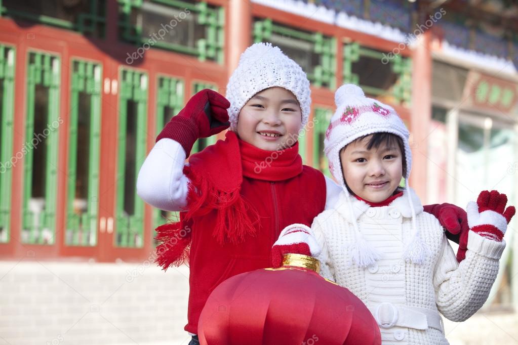 Children holding red lantern