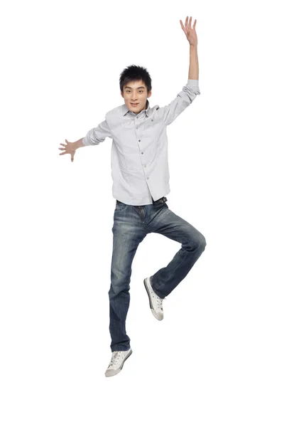Portrait of a young man mid-air — Stock Photo, Image
