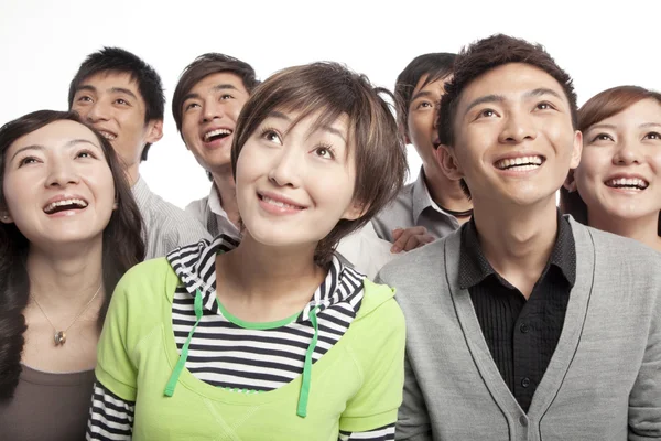 Group of young people looking up in excitement — Stock Photo, Image