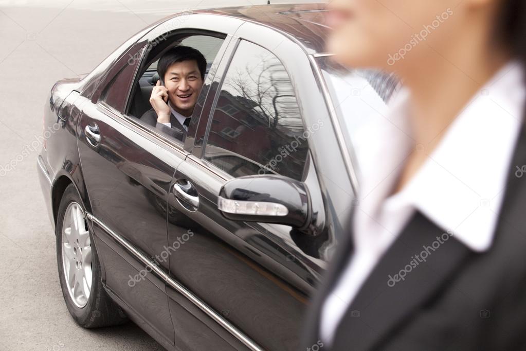 Businessman on phone looking out window