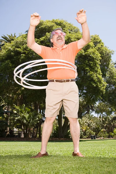 Fat Man with hoops — Stock Photo, Image