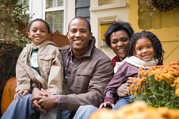 Family in front of house Stock Picture