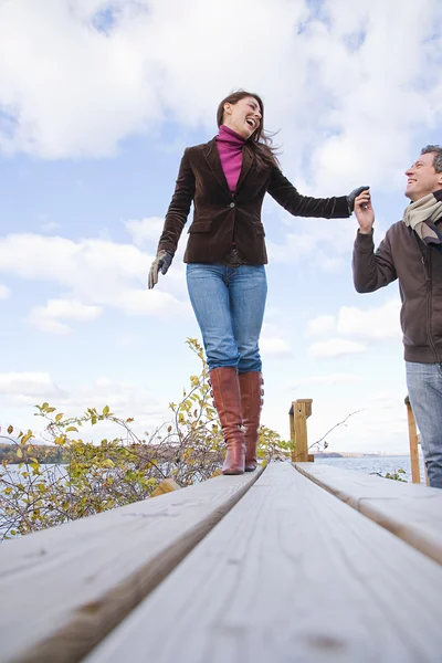 Couple holding hands and walking — Stock Photo, Image