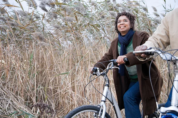 African couple cycling — Stock Photo, Image